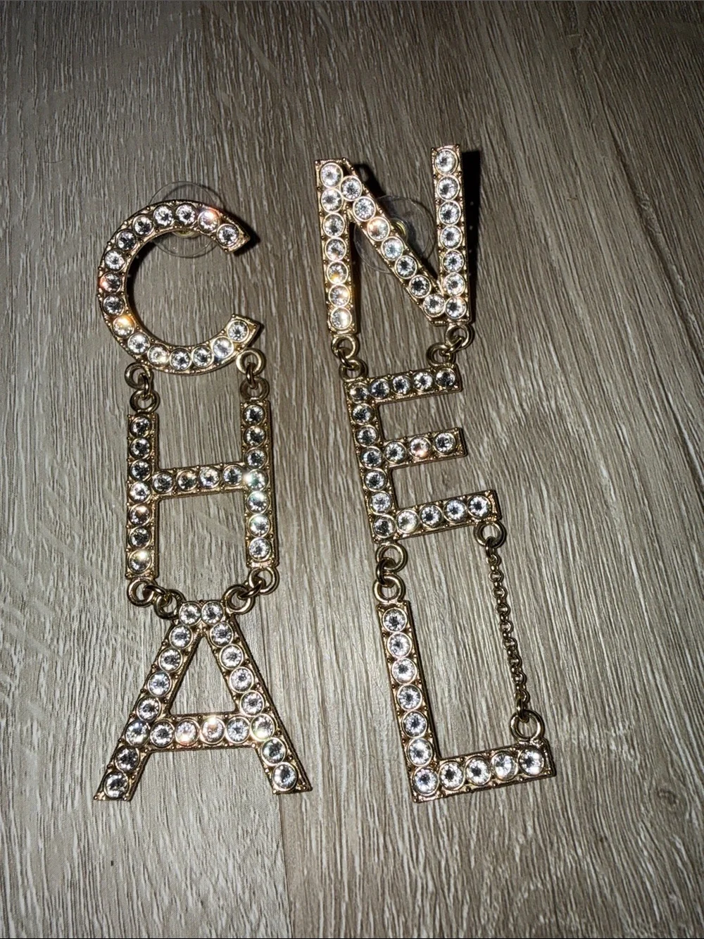 CHANEL Gold Crystal Logo Dangle Earrings